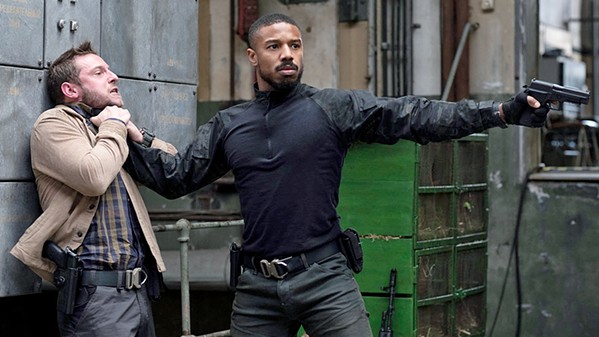MAN ON FIRE Navy SEAL John Clark (Michael B. Jordan, right) chokes CIA operative Robert Ritter (Jamie Bell) in Tom Clancy's Without Remorse, a new straight-to-streaming film on Amazon Prime. - PHOTO COURTESY OF NEW REPUBLIC PICTURES