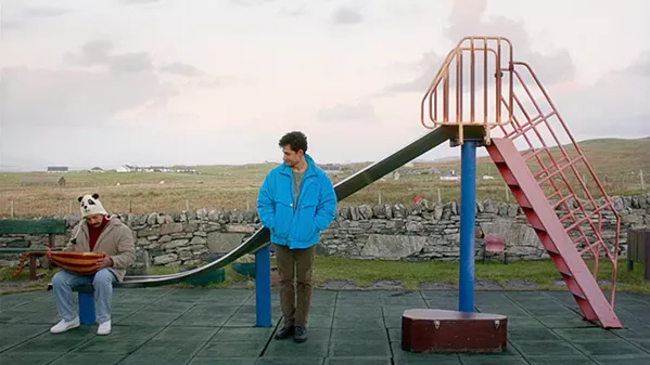 WHAT IN THE OUD? Promising young Syrian musician Omar (Amir El-Masry, right) finds himself stuck on a Scottish island as he awaits a ruling on his asylum request, in Limbo, screening exclusively at The Palm Theatre. - PHOTO COURTESY OF CARAVAN CINEMA