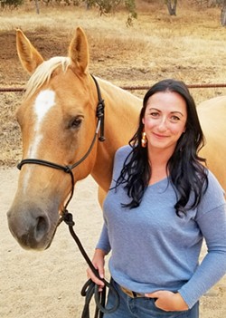 SUPERWOMAN When not working at SLO Coast Wine Collective as its executive director and only paid employee, Kathleen Naughton is immersed in the animal kingdom, raising pets&mdash;including her 6-year-old horse, Piper&mdash;as well as worms. - PHOTO COURTESY OF SLO COAST WINE COLLECTIVE
