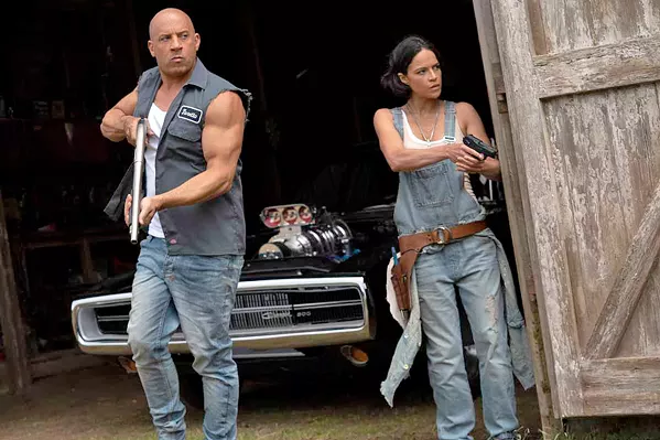 CALL FIRST NEXT TIME Dom (Vin Diesel) and Letty (Michelle Rodriguez) react to unexpected visitors at their secluded home, in F9: The Fast Saga, now screening at local theaters. - PHOTO COURTESY OF ONE RACE FILMS
