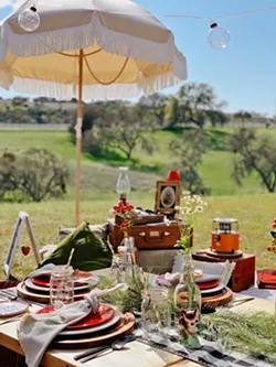 INTO THE FOREST Wildernest Picnic Co. sets up its glamping-themed "Babes in the Woods" picnic spread in March at a private property in Templeton. The owners wanted to commemorate the future site of their home. - PHOTO COURTESY OF WILDERNEST PICNIC CO.