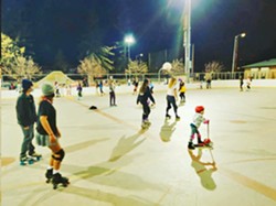GROUP SKATE SLORoll hosts monthly community skate nights, like this one recently at Santa Rosa Park in San Luis Obispo. The skates include a DJ, party lights, and are open to skaters of all ages and wheels. - PHOTO COURTESY OF SLOROLL COMMUNITY INITIATIVE