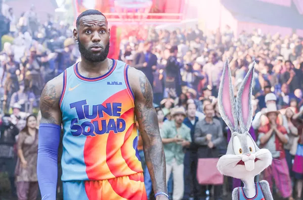 TEAM WORK LeBron James teams with Bugs Bunny and other cartoon characters to win a basketball game and save his son, himself, and his family from being trapped inside a computer network, in Space Jam: A New Legacy, in local theaters and on HBO Max. - PHOTO COURTESY OF WARNER BROS.