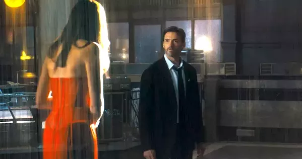 SCI-FI SLEUTH After the woman he loves goes missing, Nick Bannister (Hugh Jackman) begins revisiting his own memories over and over in an attempt to find clues and track her whereabouts, in Reminiscence. - PHOTO COURTESY OF WARNER BROS. PICTURES