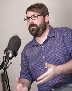 HOMEGROWN PODCASTER Central Coast native Chris Lambert discusses his viral podcast Your Own Backyard in his new home studio in Orcutt. - PHOTO BY JAYSON MELLOM