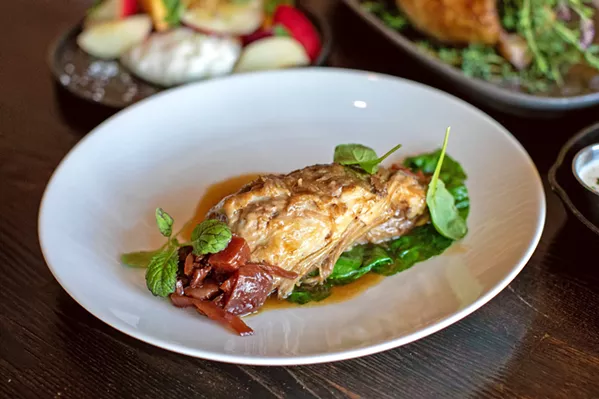 SAVORY SWINE White cheddar grits, apple-thyme chutney, and wilted greens complement the pork shoulder dish at The Hatch Rotisserie & Bar in Paso Robles. - PHOTO COURTESY OF THE HATCH ROTISSERIE & BAR