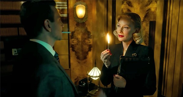 GRIFTERS? In the film noir thriller Nightmare Alley, sideshow "psychic" Stan Carlisle (Bradley Cooper) teams up with corrupt psychiatrist Dr. Lilith Ritter (Cate Blanchett) to bilk Chicago's elite, but who's conning whom? - PHOTO COURTESY OF FOX SEARCHLIGHT PICTURES