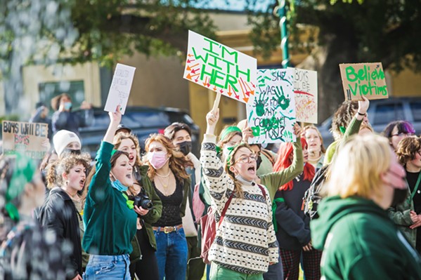 SPEAKING OUT Atascadero High School students walked from their school to the Sunken Gardens on Dec. 17 to protest the way their administration handles allegations of sexual assault, bullying, and harassment. - PHOTO BY JAYSON MELLOM