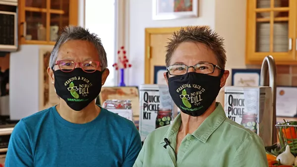 NO BIG DILL As members of the Estero Bay Community Emergency Response Team, Quick Pickle Kit co-owners Meaghan Gilbert, left, and Andrea Wasko deliver free produce—and a little levity—to neighbors in Cayucos, Morro Bay, and Los Osos. Their original mask design is available for purchase online. - PHOTO COURTESY OF QUICK PICKLE KIT
