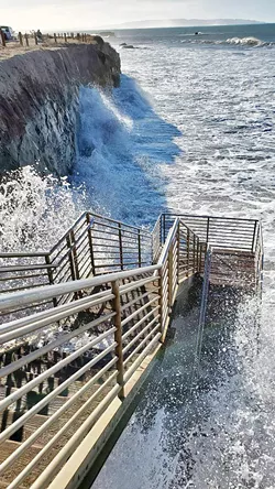 RISING WATERS Climate change is causing increasing levels of anxiety in people. A 2020 poll found that two-thirds of Americans were anxious about the crisis. Pictured here: king tides in Pismo Beach, an annual phenomenon that shows what a climate change-impacted ocean would look like. - FILE PHOTO COURTESY OF THE KING TIDES PROJECT