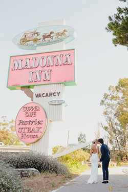 BOOKED 2022 is gearing up to be a historically busy year for weddings. Venues like the Madonna Inn in SLO, which are not accustomed to booking many non-weekend weddings, are filling up even on weekdays. - COURTESY PHOTO BY LAUREN CATE PHOTOGRAPHY