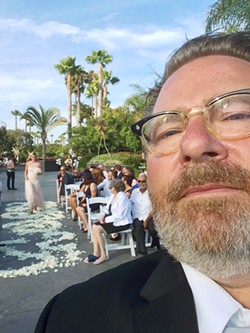 WEDDING SELFIE Glen Starkey snapped a photo as a bridesmaid makes her way forward during a wedding in San Diego&mdash;the last one he performed before retiring from the wedding racket. - PHOTO COURTESY OF GLEN STARKEY