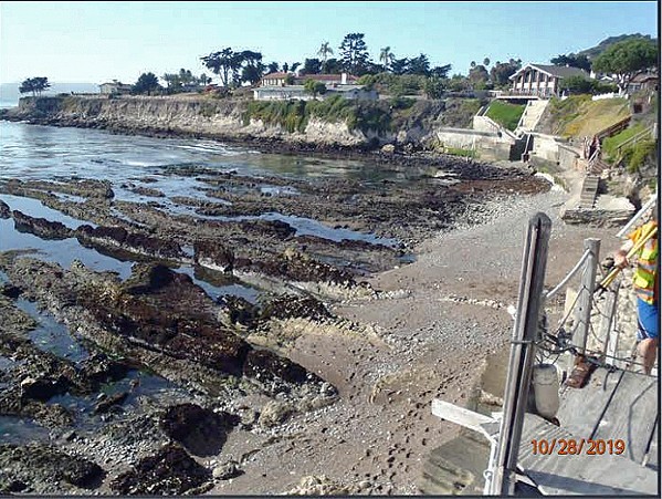 CRUMBLING AWAY From 2008 to 2021, three separate site surveys of the area by the Hyman-Okerblom residences (pictured) showed that the bluff retreated by 15 to 18 inches each year. - SCREENSHOT FROM ADDITIONAL MATERIALS FOR COASTAL COMMISSION HEARING