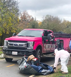 DOING A JOB SLO contracts with 2 Mexicans Junk Removal to clean out homeless encampments, including a February cleanup off Prado Road near the Bob Jones Trail. - COVER PHOTO BY BULBUL RAJAGOPAL