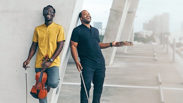 RELUCTANT CLASSICAL As children, neither Kev Marcus nor Wil B were interested in playing the violin and viola, but thanks to their strong mothers, they persevered, eventually becoming Black Violin and playing March 20 at the SLO Performing Arts Center. - PHOTO COURTESY OF MARK CLENNON