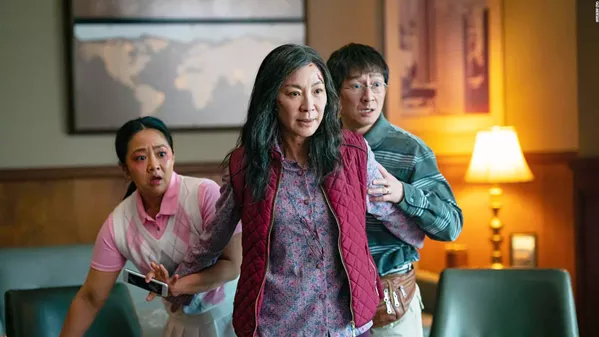 KUNG FU MISTRESS Michelle Yeoh (center) stars as Evelyn Wang, a mild-mannered mother and wife with a struggling laundry business who's suddenly called upon to save the multiverse when a malevolent superbeing threatens all existence, in Everything Everywhere All at Once, screening in local theaters. - PHOTO COURTESY OF AGBO, HOTDOG HANDS, AND LEY LINE ENTERTAINMENT