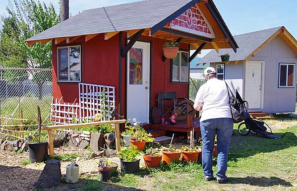 COMMUNITY LIVING In Oregon's Lane County, residents of SquareOne Village's tiny homes thrive in a community setting, which features a shared bathhouse and outdoor kitchen services. - PHOTO COURTESY OF SQUAREONE VILLAGES