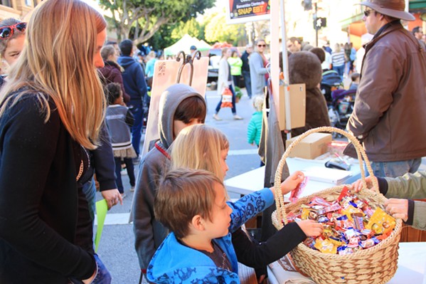 EASTER TREATS Kids can enjoy trick or treating in spring by following the trail map to participating local stores in Downtown SLO to receive candy. - PHOTOS COURTESY OF DOWNTOWN SLO