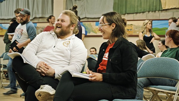 HAVE FUN TO MAKE FUN Cast members Mitchell Hardy and Ally King share a laugh during the rehearsal of Carousel, a musical about two young couples trying to forge successful futures in 1873 Maine. - PHOTO COURTESY OF KYLE MOORE