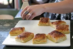 PUFF PASTRIES, CUBAN STYLE! : Guests had a choice between savory tempeh and buffalo-stuffed or sweet fruit and cheese-filled pastries—Cuban specialties called pastelitos, which means little pies. - PHOTO BY GLEN STARKEY