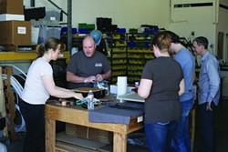 MAKERS:  A group of do-it-yourselfers gathers around a worktable to share their skills. - PHOTO BY GLEN STARKEY