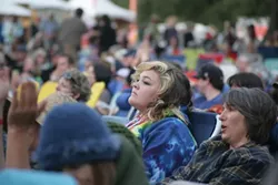 A FACE IN THE CROWD : The myriad acts on Live Oak’s main stage garnered rapt attention from the throngs of concertgoers.