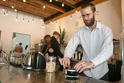 POUR ME ANOTHER: Spearhead Coffee lead barista Matt Klomp whips up a drink with finesse and deft skill. The Paso Robles specialty coffee house invites the community to celebrate its grand opening this Friday, May 22. - PHOTO BY HAYLEY THOMAS