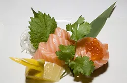 A TASTE OF SCOTLAND: The six-piece Scottish salmon with salmon roe is one of Kanpai Sushi’s most popular sashimi orders. - PHOTO BY DAN HARDESTY