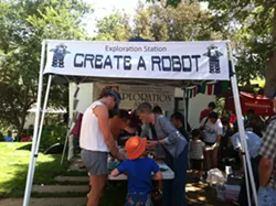 MAKING MOMENTS : The Mini Maker Faire on May 11 brought robots to life, music to banjos, and families together. - PHOTO BY MAEVA CONSIDINE