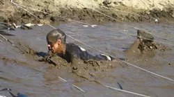 MUD MAN : Competitors had to crawl under army wire in the mud to get to the finish line, and here I am whining about having to take pictures whilst hungover. If I didn’t know any better, I’d suspect that I’m an asshole.