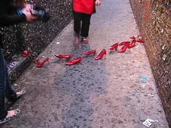 BUBBLEGUM ALLEY INSTALLATION : The Nothing Happened Here duo added some color to Bubblegum Alley with a shoe installation on Aug. 23. - PHOTO BY MIGNON KHARGIE
