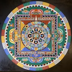 COLOR WHEEL: For each mandala, the monks pour millions of grains of sand into a traditional pattern using a funnel tool called chak-pur. The process can take up to five days to complete. - PHOTO COURTESY OF ANET CARLIN