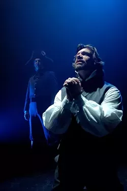 SHADES OF GRAY : Jean Valjean (Sam Zeller) pursues redemption while shadowed by the immoveable Javert (Erik Stein). - PHOTO BY LUIS ESCOBAR/ REFLECTIONS PHOTOGRAPHY STUDIO