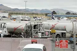 THEY NEED STEENKIN’ BADGES : Anybody passing the fence at the San Luis Obispo County Airport will need a security badge or an escort. The new requirement extends the sort of security measures already in place for commercial airline employees to the private aviation side. - PHOTO BY STEVE E. MILLER