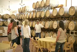 INTO THE CELLAR : Paul Hoover, owner of Still Water, takes us into his temperature-controlled cellar for a private tasting straight out of the barrels. - PHOTO BY GLEN STARKEY