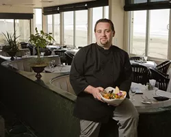 BY HIS BOOTSTRAPS : The Sea Venture’s Everett Walcott remembers his humble beginnings while creating delicious dishes. - PHOTO BY STEVE E. MILLER