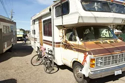 BACK ON TARGET : Recreational vehicles line Prado Road in San Luis Obispo in this file photo from February, during the height of San Luis Obispo’s sweep on people sleeping in their cars on public streets. - FILE PHOTO BY STEVE E. MILLER