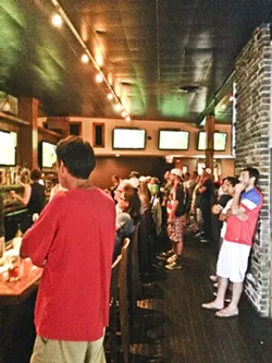 STANDING ROOM ONLY: Soccer fans packed Tompkins Square Bar & Grill in Los Angeles for the USMNT’s match against Portugal on June 22. - PHOTO BY RHYS HEYDEN