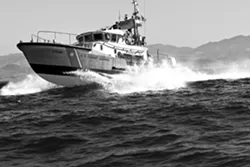 CUTTING TO THE CHASE: A U.S. Coast Guard response boat—known as a cutter—hightails it out of the mouth of Morro Bay Harbor, which has housed an agency station since the early 1990s. The Coast Guard is currently in talks with the city over leasing a site that would allow them to expand their facility. - FILE PHOTO BY STEVE E. MILLER