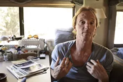 BATTLE SCARS : Robert Davis has had 25 skin-cancer surgeries over the past four years and he has the scars to prove it. He also suffers from lymphoma and smokes marijuana to counteract his lost appetite. - PHOTO BY STEVE E. MILLER