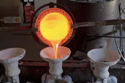 Liquid bronze fills the mold. - PHOTO BY STEVE E. MILLER