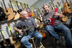 THE DAY THE MUSIC THRIVED : Floor Manager Andy Morris (left) and owner Dan Ernst have relocated Grand Central Music Conservatory to a smaller but more functional space. - PHOTO BY STEVE E. MILLER