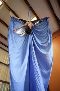 AERIAL ANGEL : Hailley teaches aerial dancing with Suspended Motion at World Rhythm and Motion Studio. - PHOTO BY STEVE E. MILLER