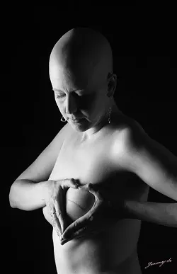 CANCER TAKES THE BODY BUT NOT THE SOUL : Breast cancer survivor Leslie Neely shows off her scar, which could have been a lot worse had she not had a mammogram that diagnosed her cancer early, in photographer Jimmy de’s image entitled “Battle Scars.” - PHOTO BY JIMMY DE