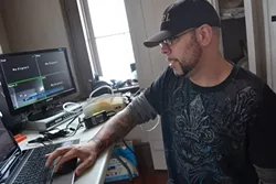 PARANORMAL PROFESSIONAL: Mitch Flores, founder of the Central Coast Paranormal Investigators, sets up a complex system of cameras and microphones designed to record spirits at the Point San Luis Lighthouse in Avila Beach. - PHOTO BY RHYS HEYDEN