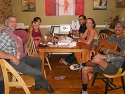HELL NO, GMOS! : Pacha (back left), Millie (on Pacha’s lap), and Fred (back right) Hornaday turned their Grover Beach home into unofficial Yes on Prop 34 and 37 headquarters. - PHOTO BY TAYLER DUPREL
