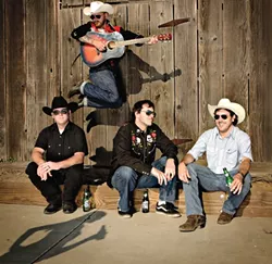BEFORE THE BULLS : Local hardscrabble country act Redeye Junction plays the Mid-State Fair’s Castaways Stage right before the Professional Bull Riding finals on Aug. 3. Yeehaw! - PHOTO BY STEVE E. MILLER