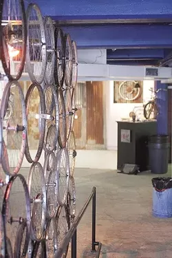 BIKELAND : The gallery space on Osos Street is an intriguing meld of bikes, art, and fun. - PHOTO BY STEVE E. MILLER