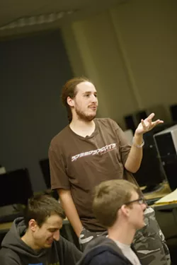 PUZZLE SOLVERS : Jon Moorman, Evan Ralston, and Eriq Augustine spent 48 hours in one room designing and building their game Road to Redemption. - PHOTO BY STEVE E. MILLER