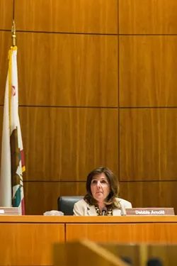 OUTMANUEVERED: After months of raising issue with the formation process of the proposed Paso Robles Groundwater Basin Water District, Supervisor Debbie Arnold succeeded in getting a 3-2 vote to insist on a fundamental change in the voting process. - PHOTO BY HENRY BRUINGTON